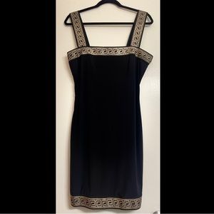 Black mini dress with gold accent design